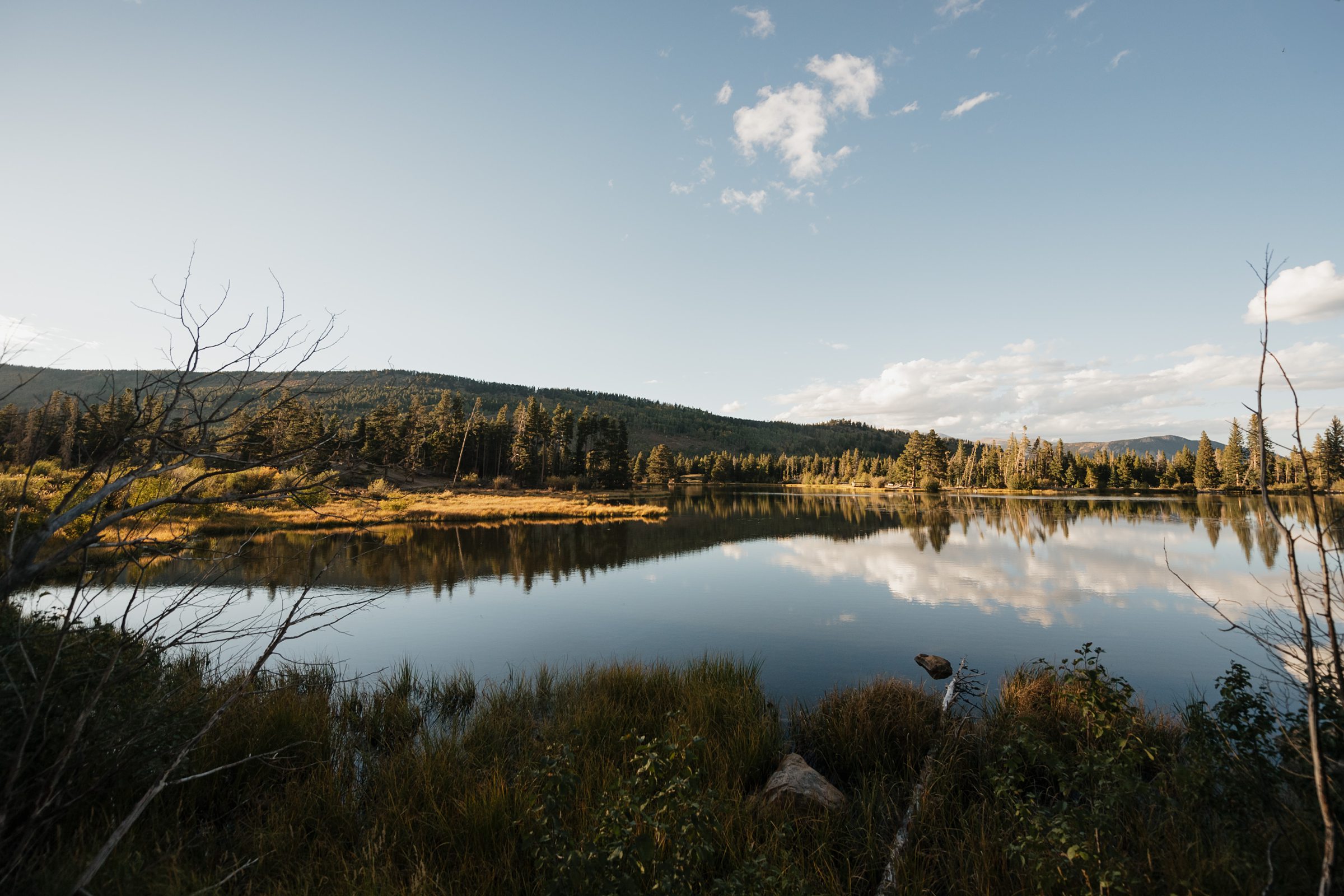View of the water at Sprague Lake in the fall